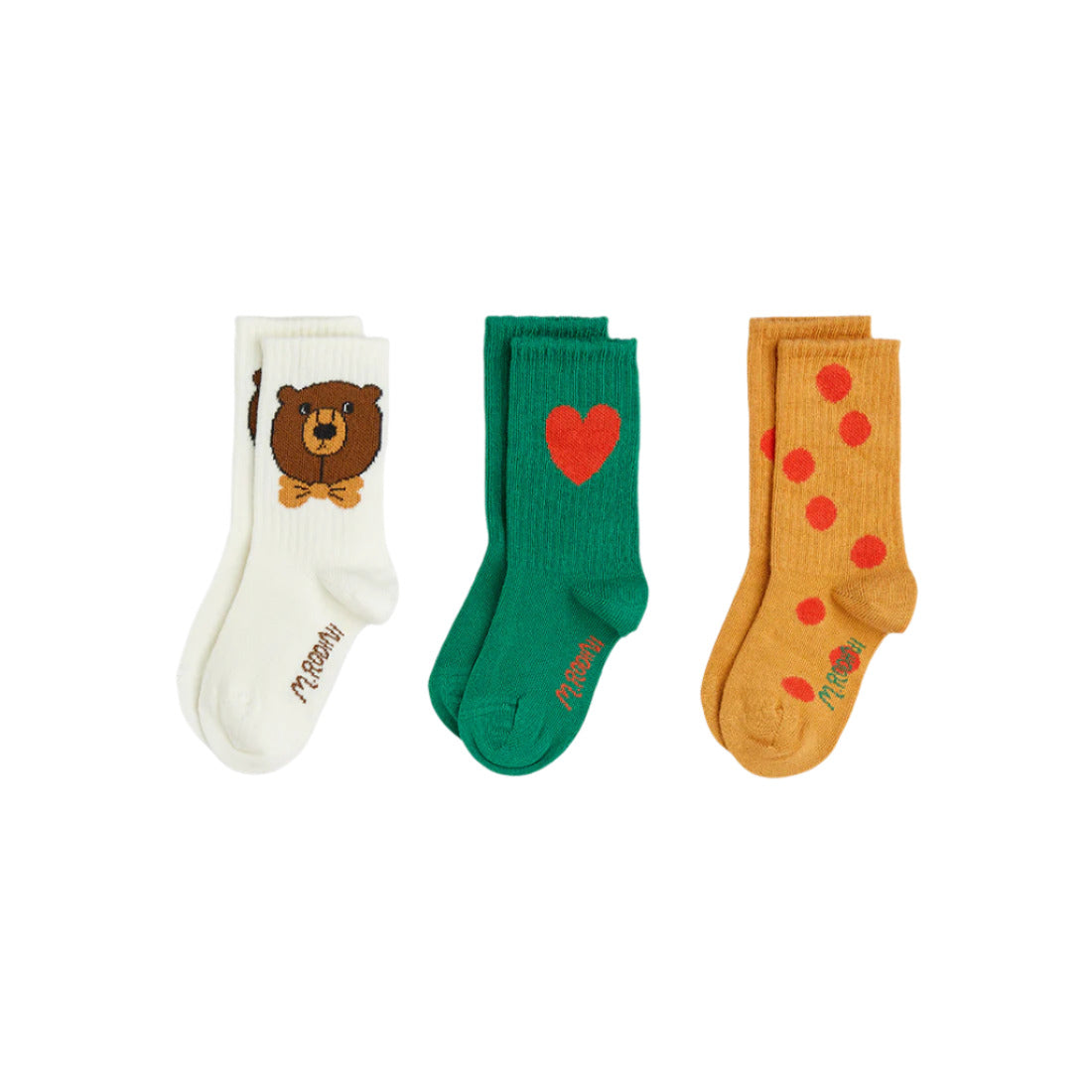 Three pairs of socks with different designs on a white background