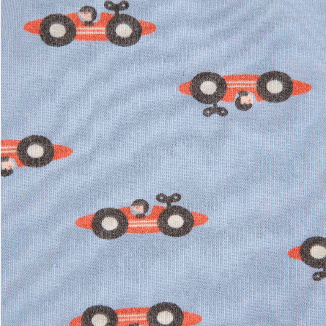 Pattern of red race cars with black tires on a light blue background