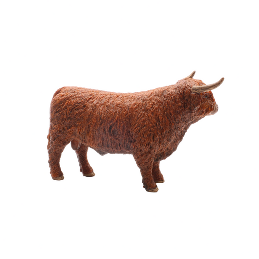 Model of a Highland cow on a white background