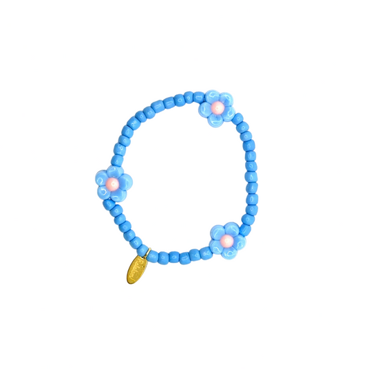 Blue beaded bracelet with a gold accent on a white background