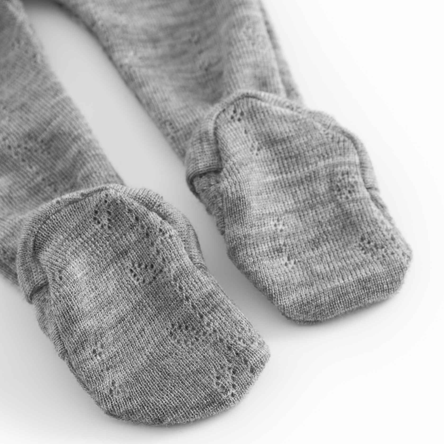 Gray tights with textured finish on a white background