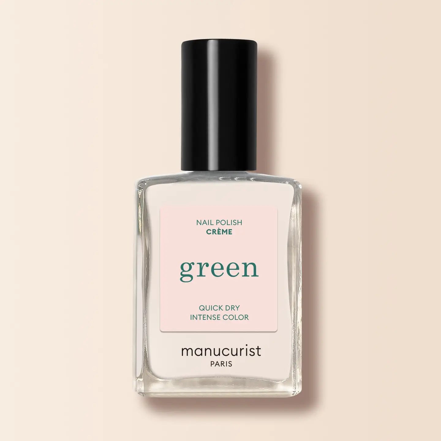 Manucurist nail polish bottle labeled 'green' on a beige background