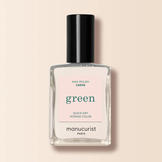 Manucurist nail polish bottle labeled 'green' on a beige background