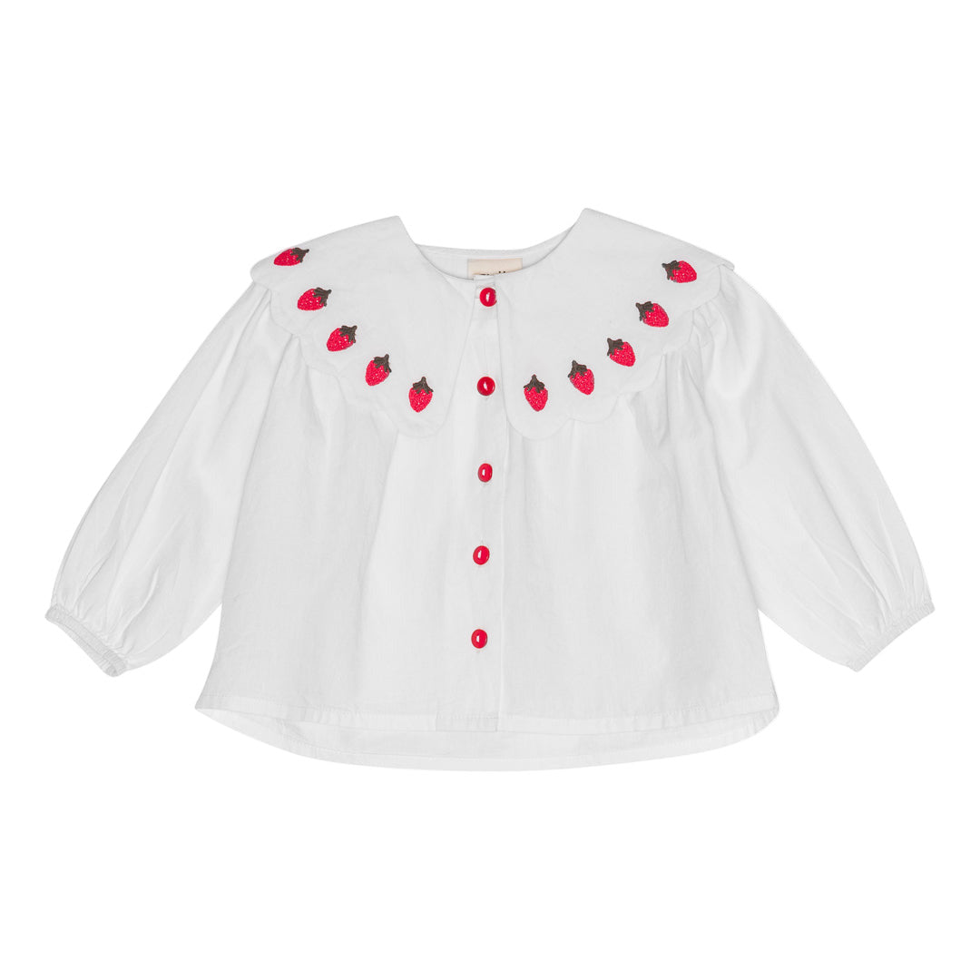 White blouse with strawberry patterns on a white background