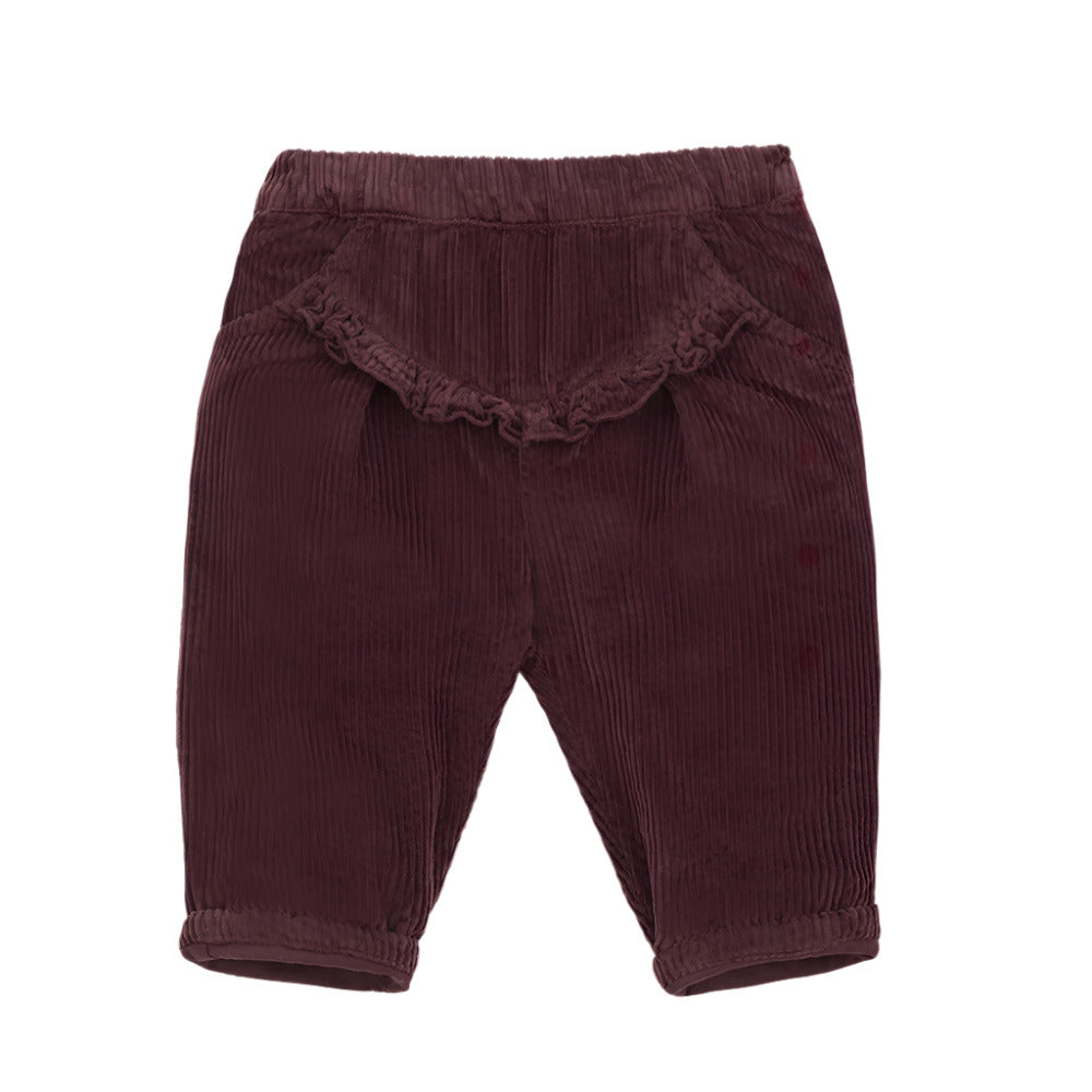 Maroon corduroy baby pants with ruffled trim on a white background