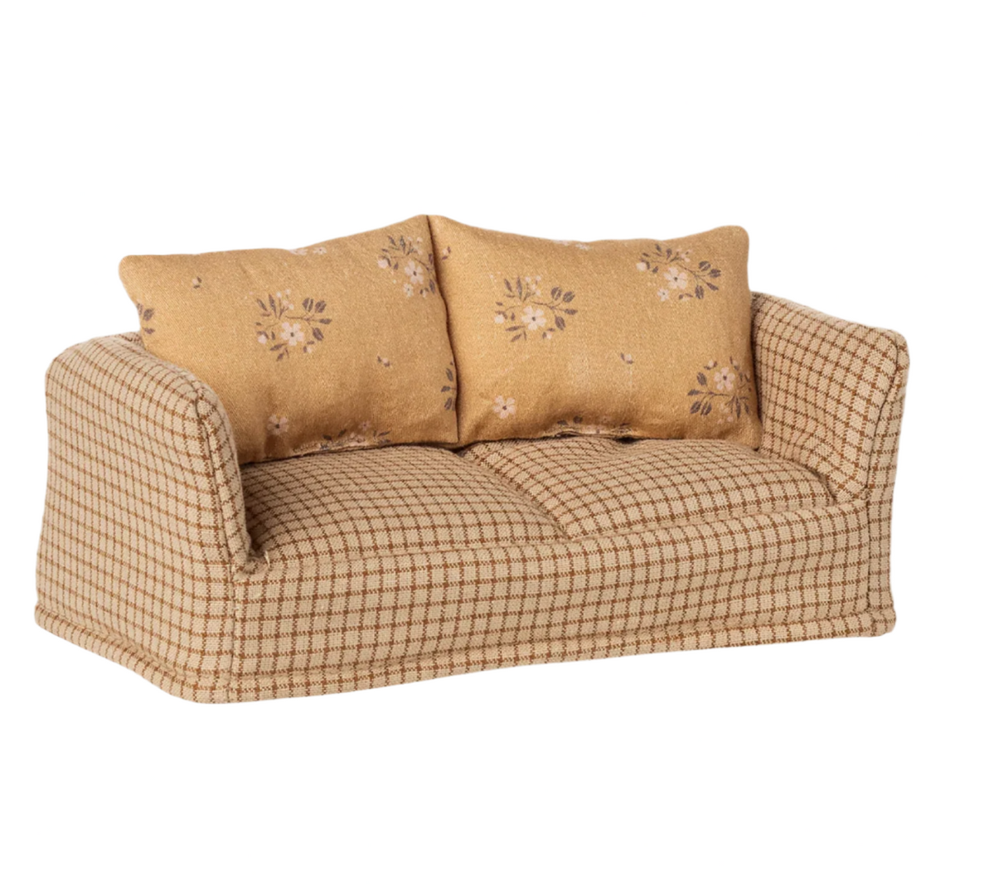 Beige checkered sofa with floral-patterned cushions on a white background