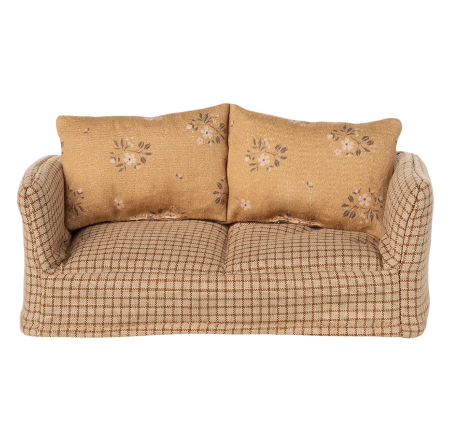 Beige sofa with floral-patterned cushions on a white background