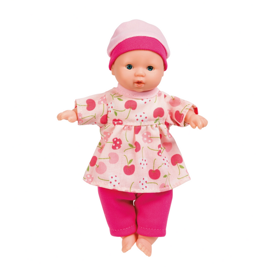 Doll wearing a pink outfit with a floral pattern on a white background