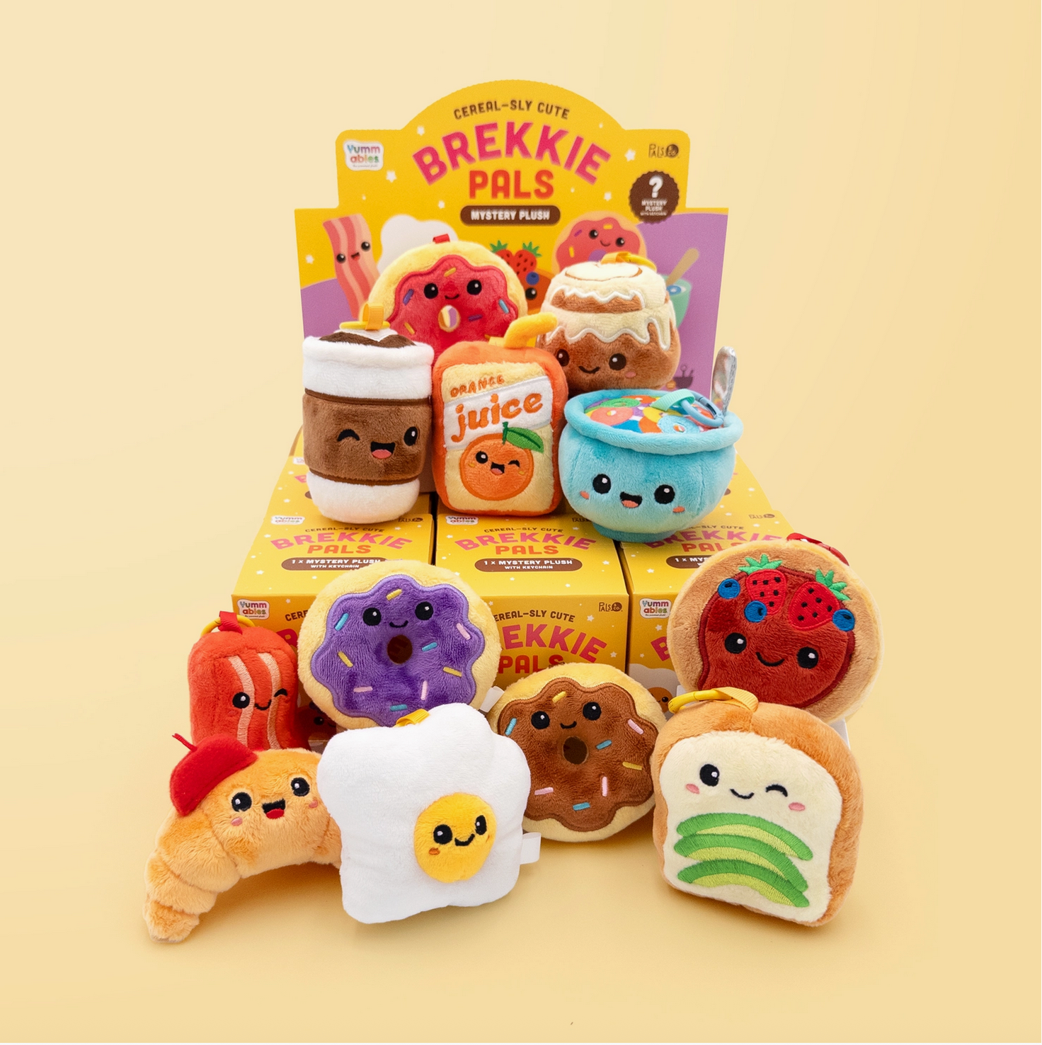 Plush toys resembling food items with their packaging on a beige background