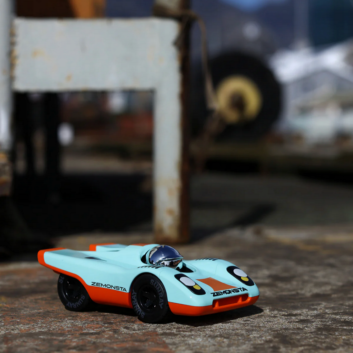 Model car on a textured surface with a blurred background