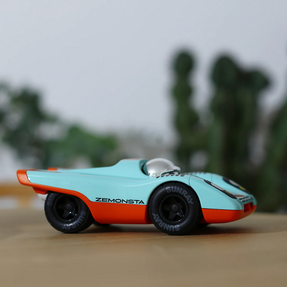 Model car with 'Zemonsta' branding on a blurred background