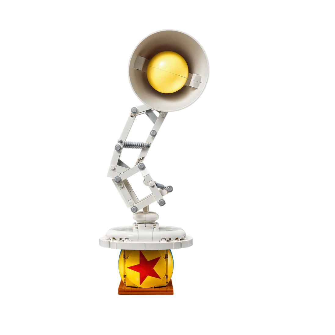 Toy figure of a lamp with a yellow light bulb on a white background