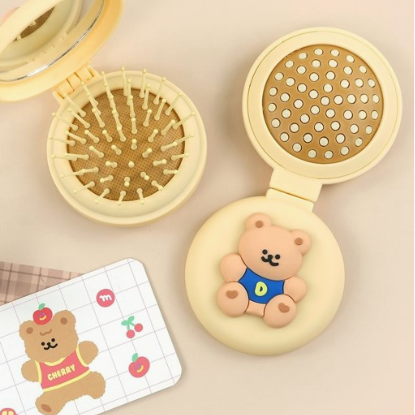 Compact with bear design, perforated lid, and textured base on a beige background