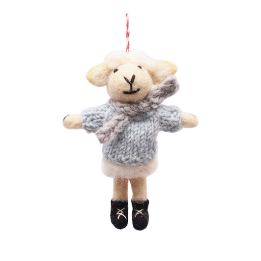 Plush sheep toy wearing a sweater on a white background