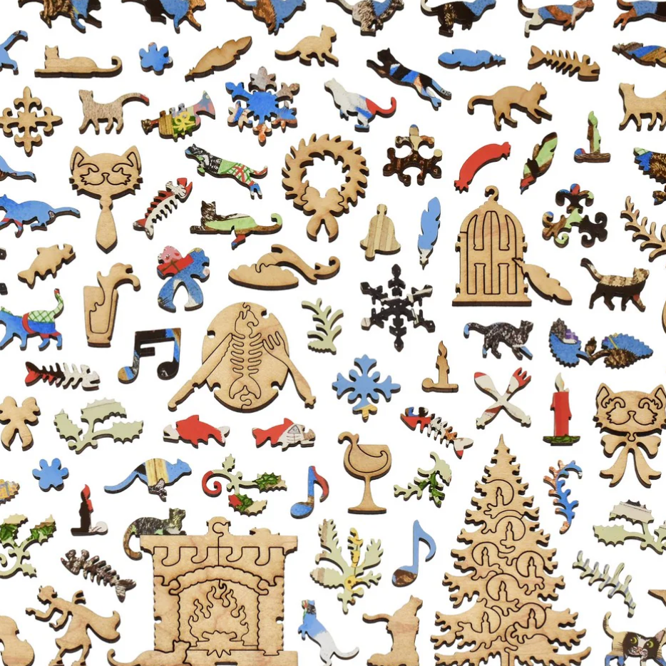 Collection of various wooden puzzle pieces on a white background
