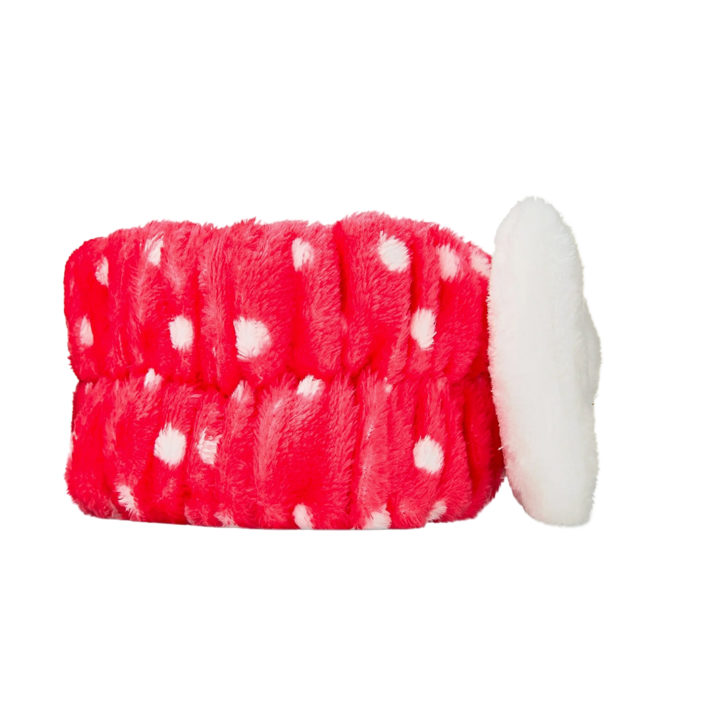 Red and white polka dot dog toy with a white ball on a white background