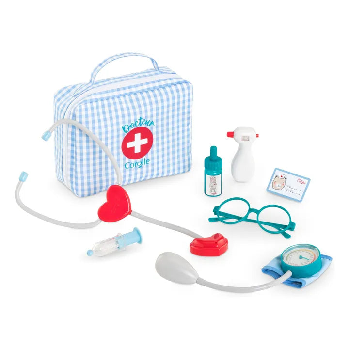 Toy doctor's kit with checkered bag, stethoscope, syringe, and other medical tools on a white background
